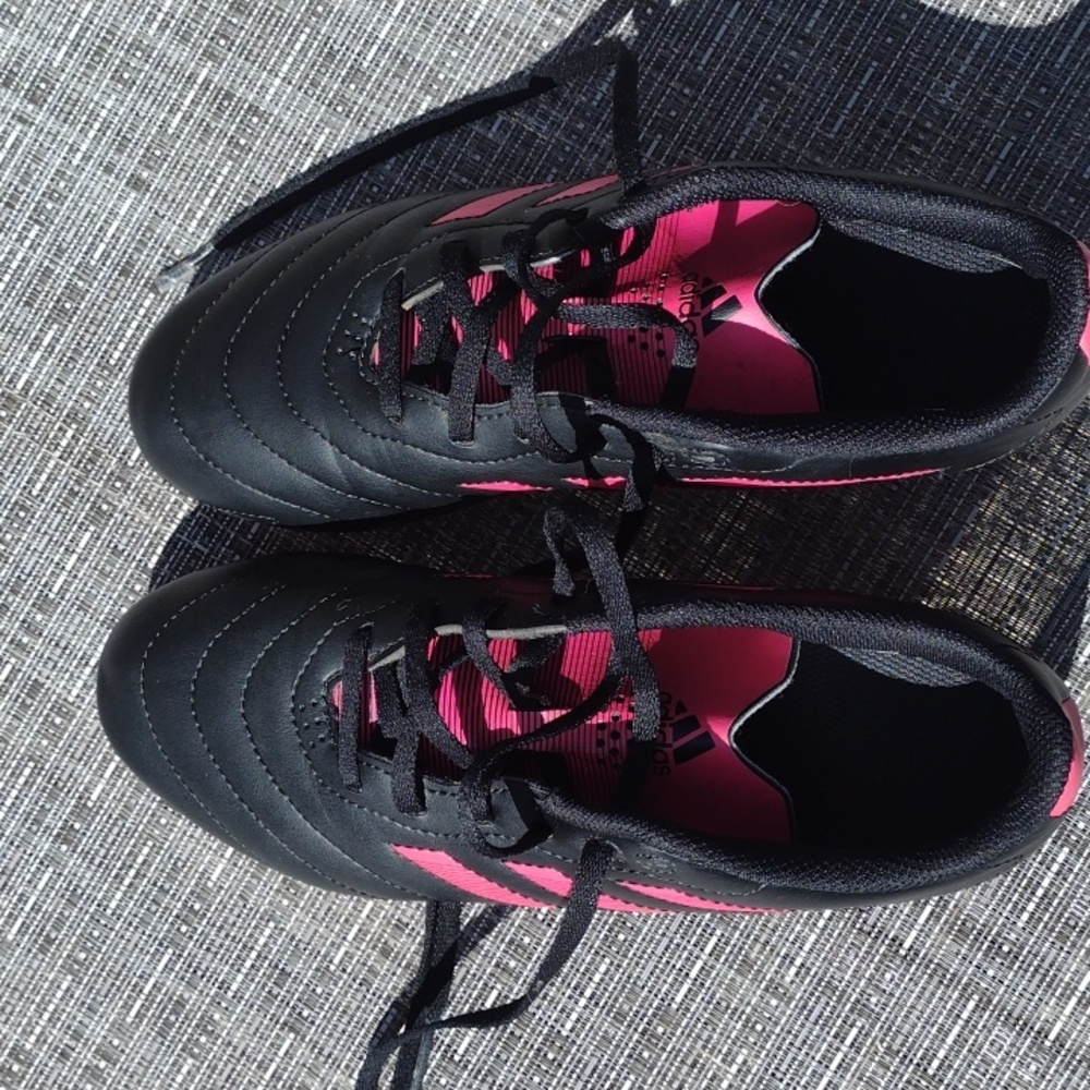 Black and pink Adidas soccer cleats